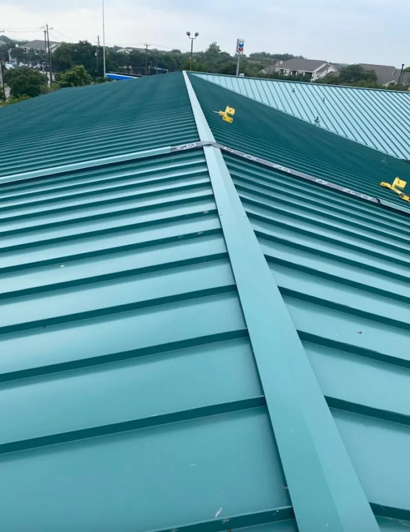 Green commercial metal roof ridge and valley for Metal Roof Repair in Yarmouth
