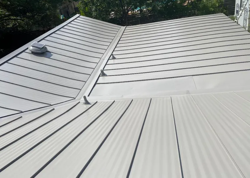 Solar attic fan installed on a metal roof for Roof Ventilation in Yarmouth